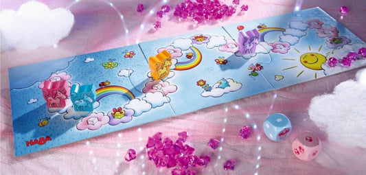 Tablero del juego Unicornio Destello El Tesoro de las Nubes con piezas de unicornio y dados coloridos