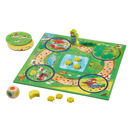 Mi Primer Tesoro de Juegos. Un juego de mesa infantil colorido con tablero, figuras y dados 