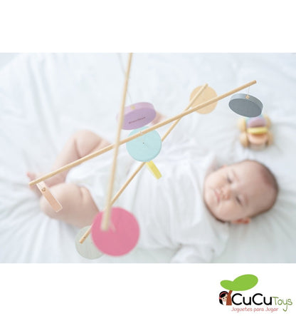 Colorful wooden mobile in pastel tones