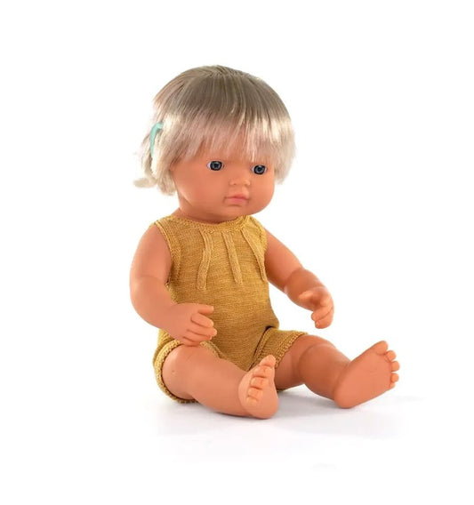 Caucasian doll with cochlear implant
